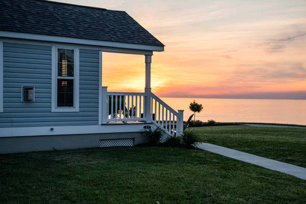 Side view of cottage with sunset in the background at The Lodge at Geneva-on-the-lake